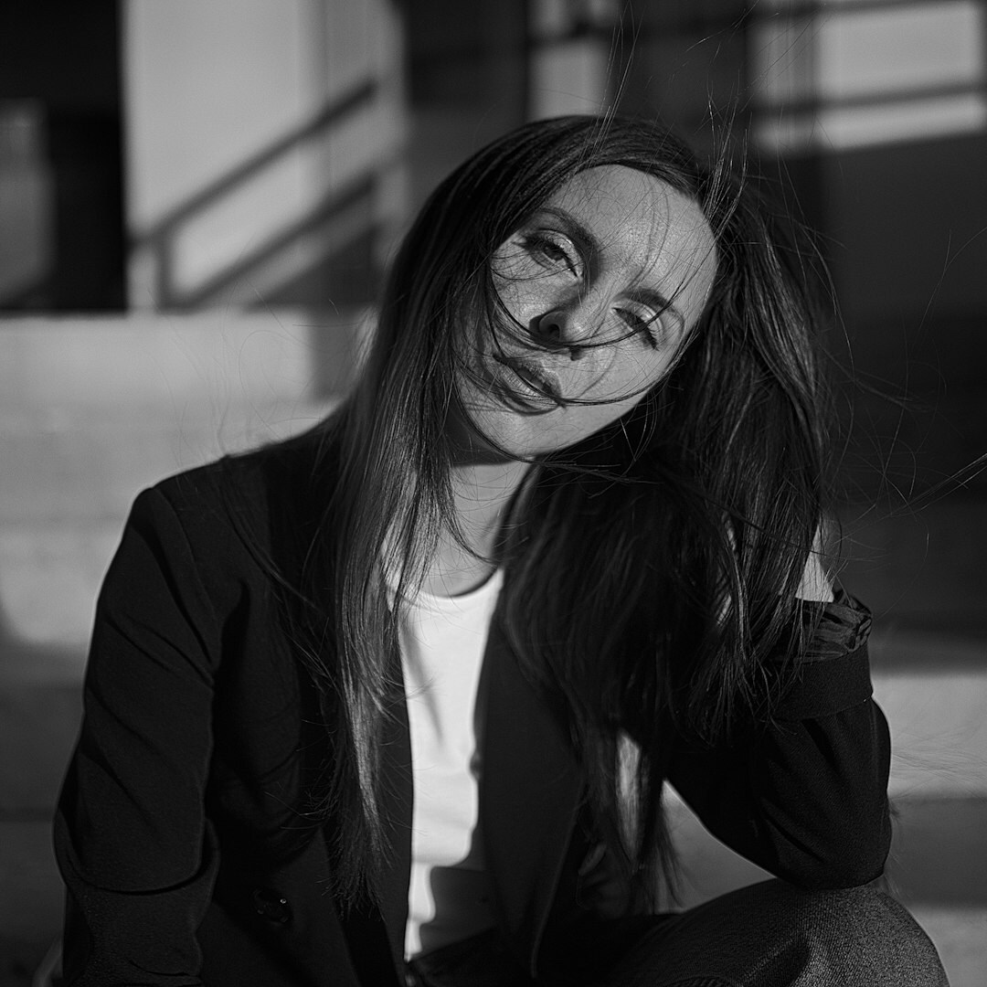 Professional Belgian woman in business attire smiling