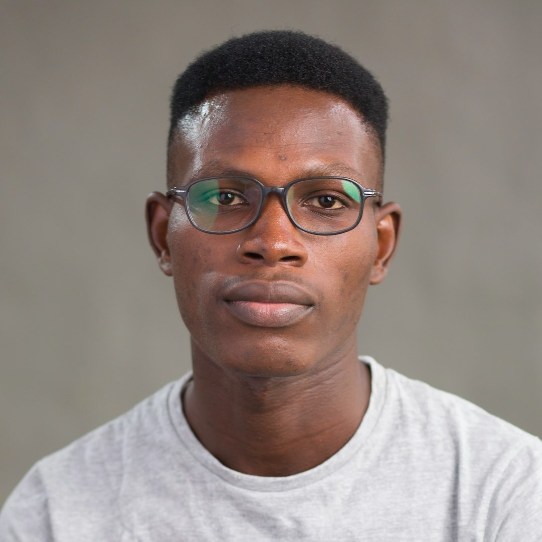 Smiling tech professional man with glasses and casual attire
